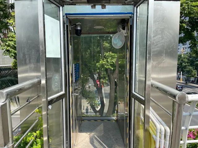 广州市广园建设公司无障碍升降机平台_无障碍升降机生产厂家_东风东路人行天桥加装电梯